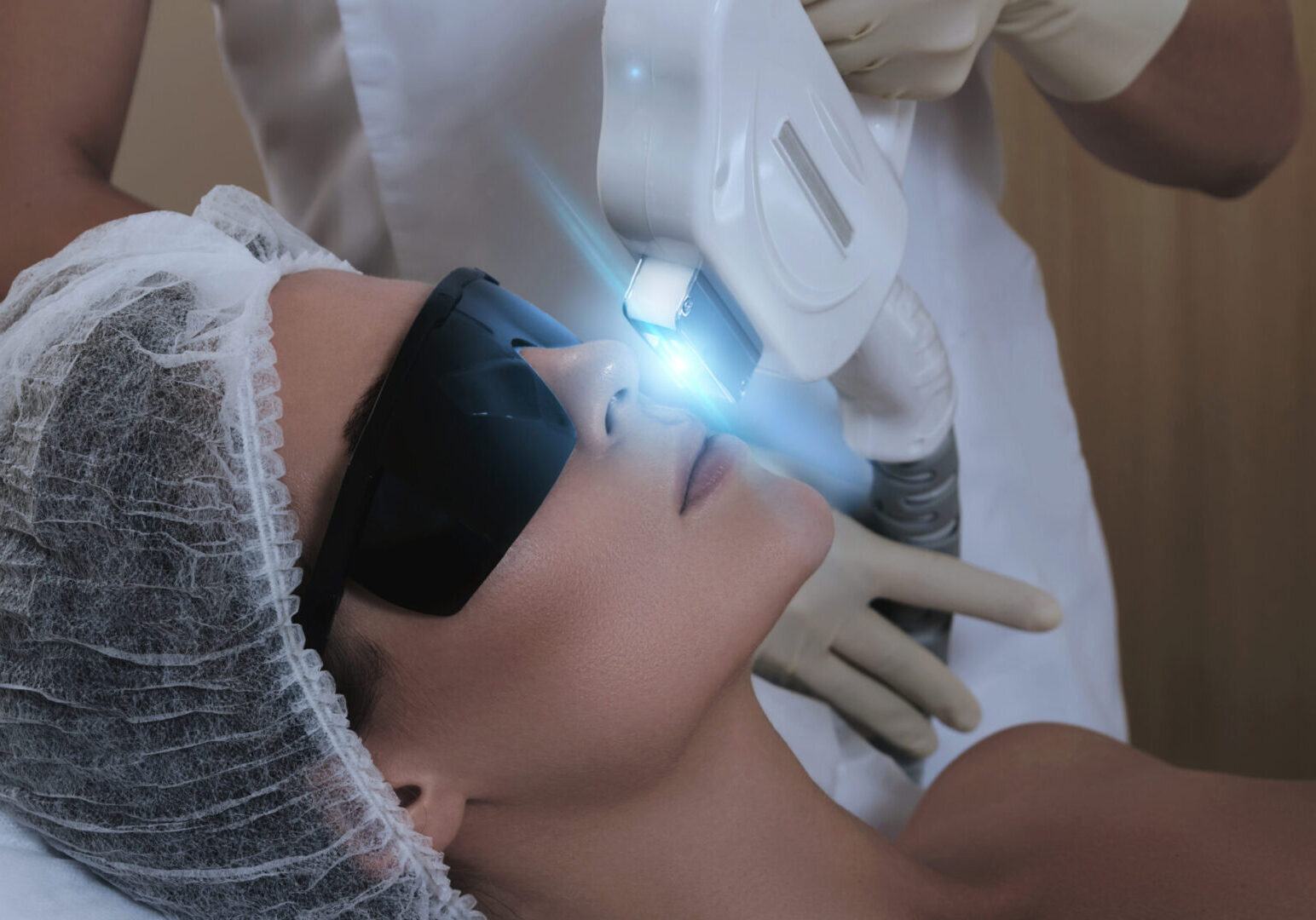 Woman in professional beauty salon during photoepilation procedure